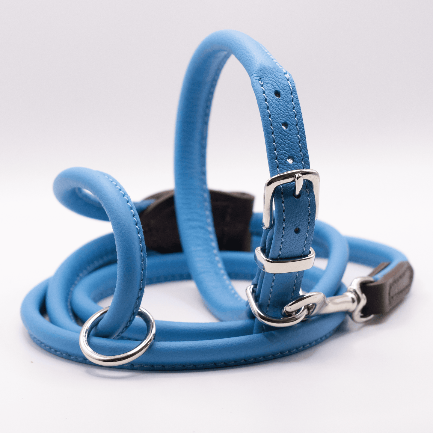 rolled soft leather dog collar and matching lead in blue with silver fittings. British Made